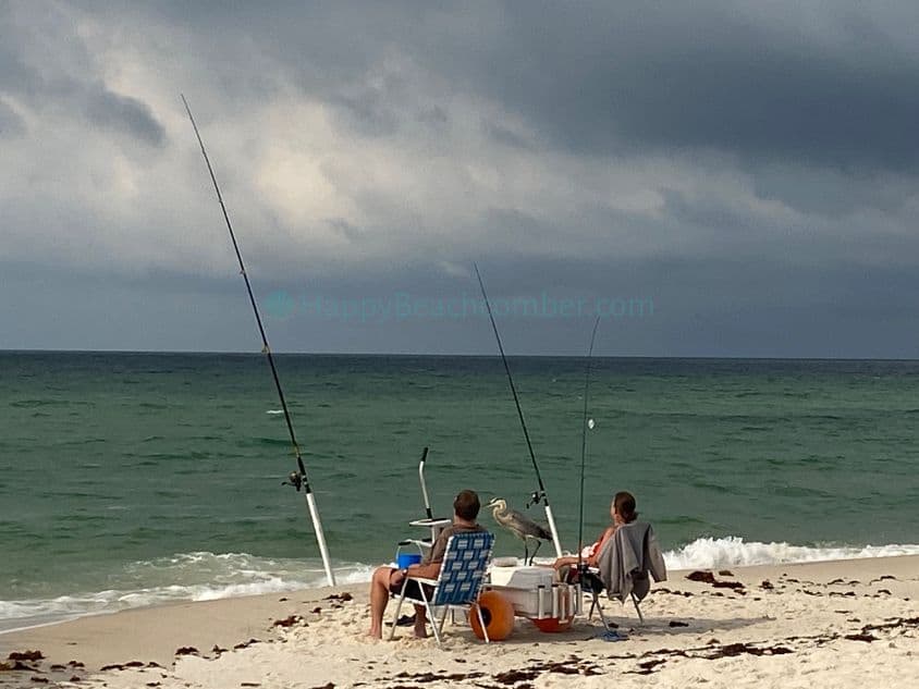 Couple Fishing and Heron Looking On